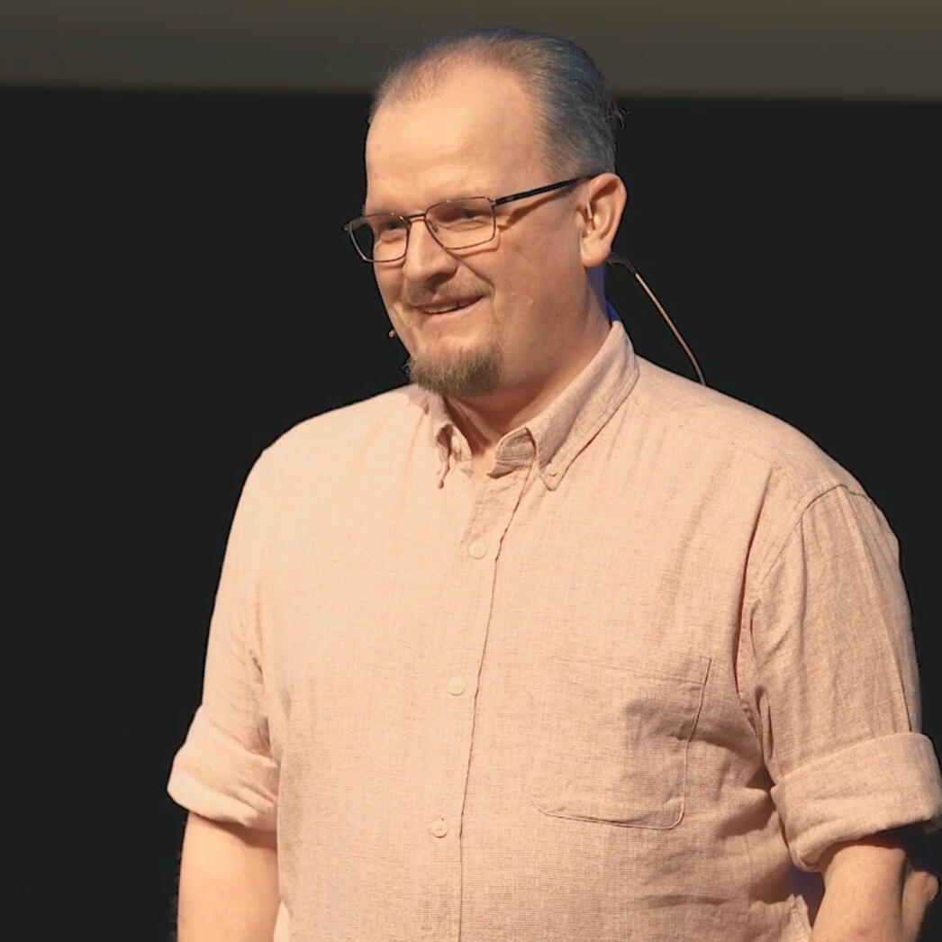 Stuart Wedge Profile A picture of Stuart Wedge, smiling, with his arms crossed.