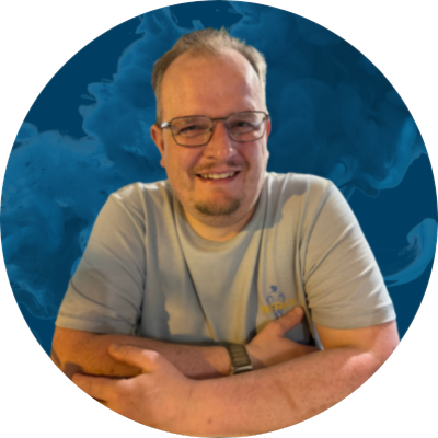 Stuart Wedge Profile A picture of Stuart Wedge, smiling, with his arms crossed.